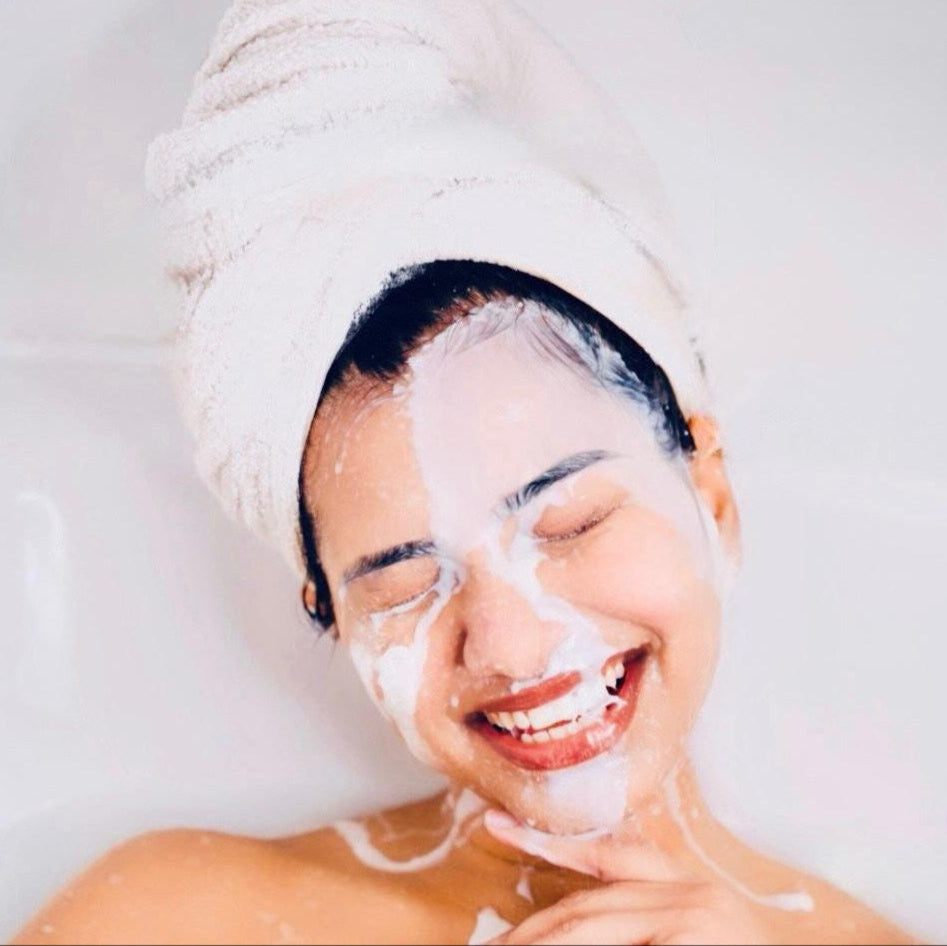 Woman enjoying a luxurious donkey milk bath – Natural skincare ritual for glowing, hydrated skin. Relaxing beauty treatment with nourishing donkey milk, known for its anti-aging, moisturizing, and skin-brightening properties. Spa-like skincare experience for smooth, radiant, and healthy skin.